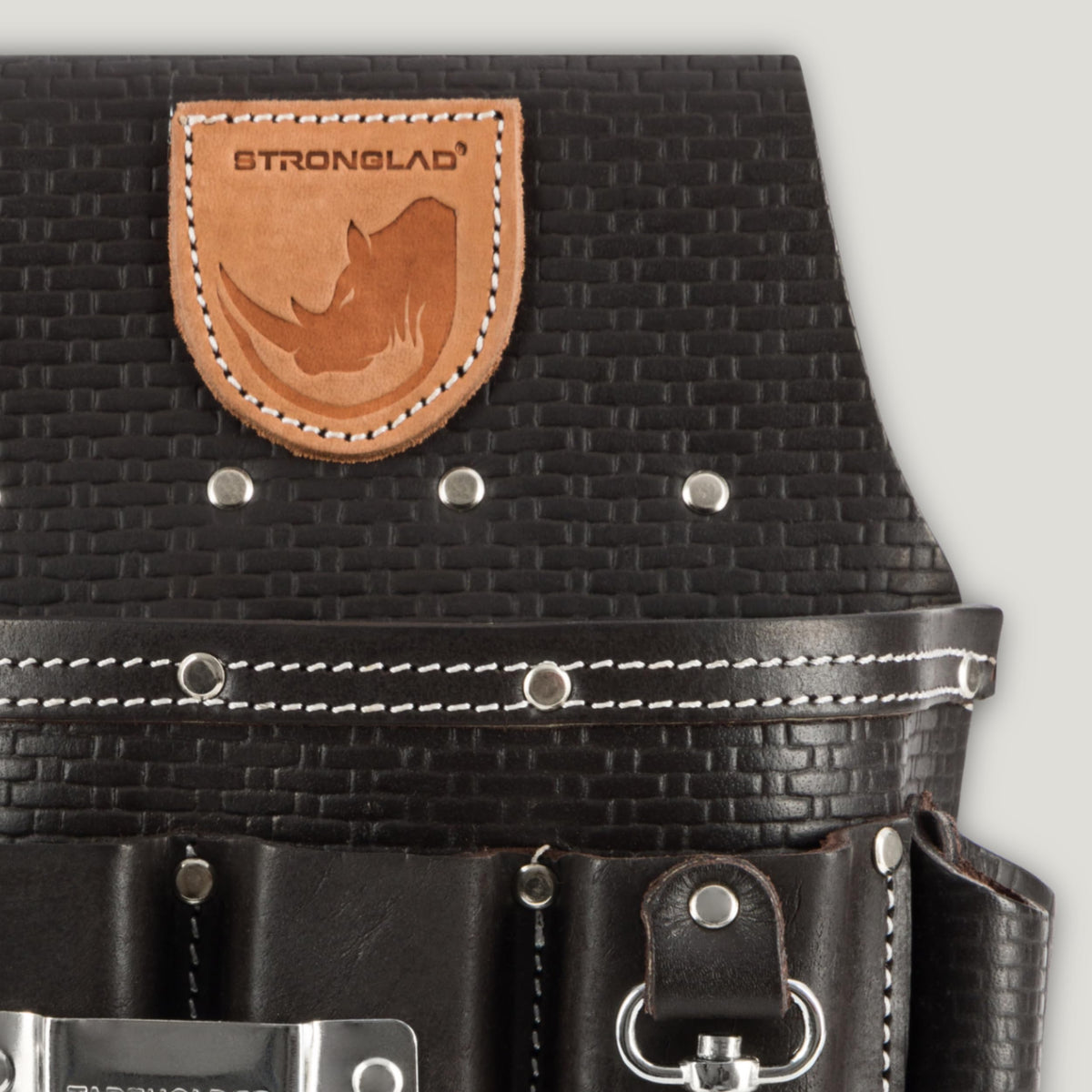 STRONGLAD branding on belt strap signals rugged, jobsite-ready tool system.