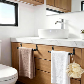 Sturdy stainless steel bar supports daily towel storage.