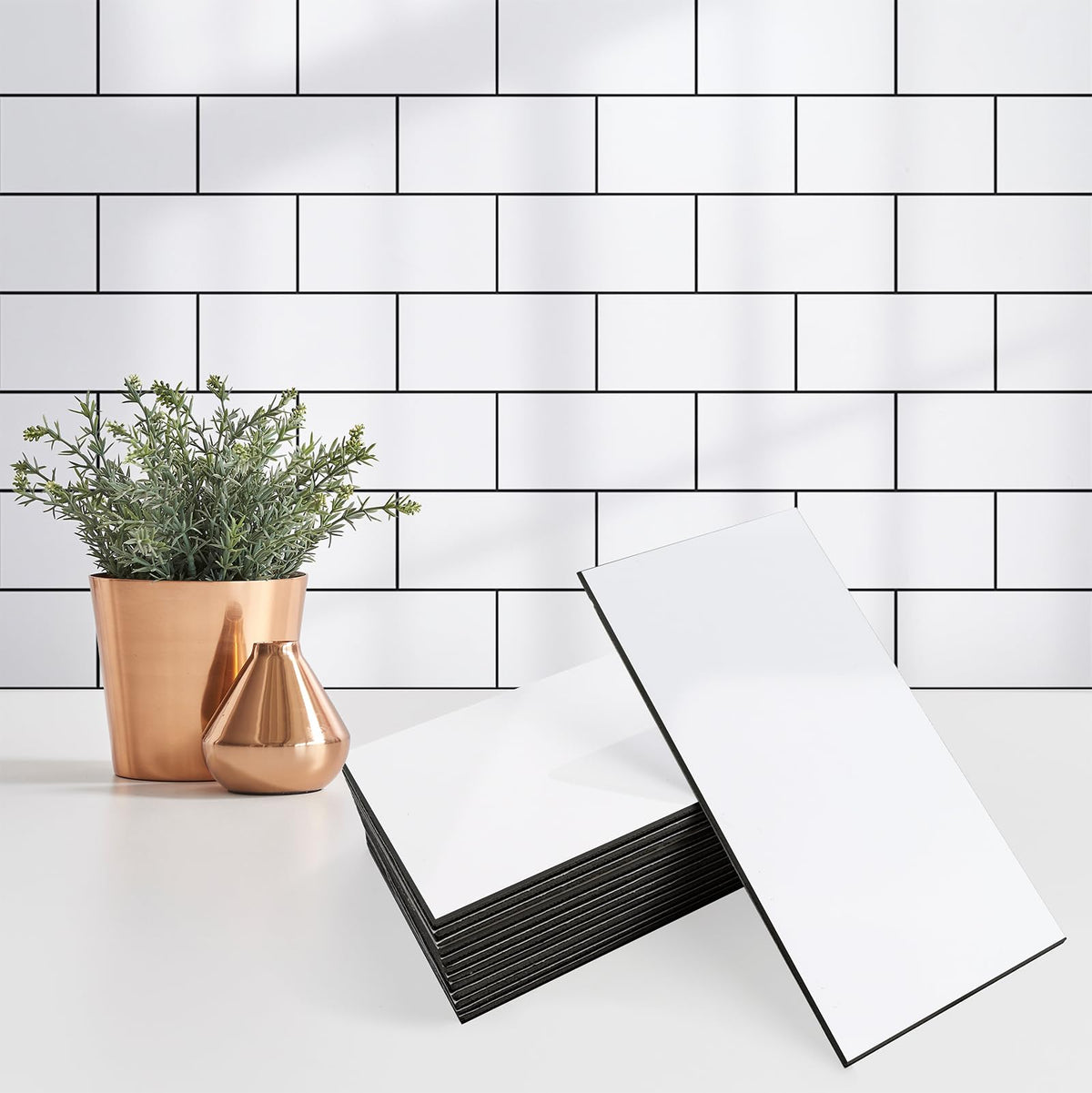 StyloVue glossy white 3x6 tile with dark gray grout for a modern kitchen.