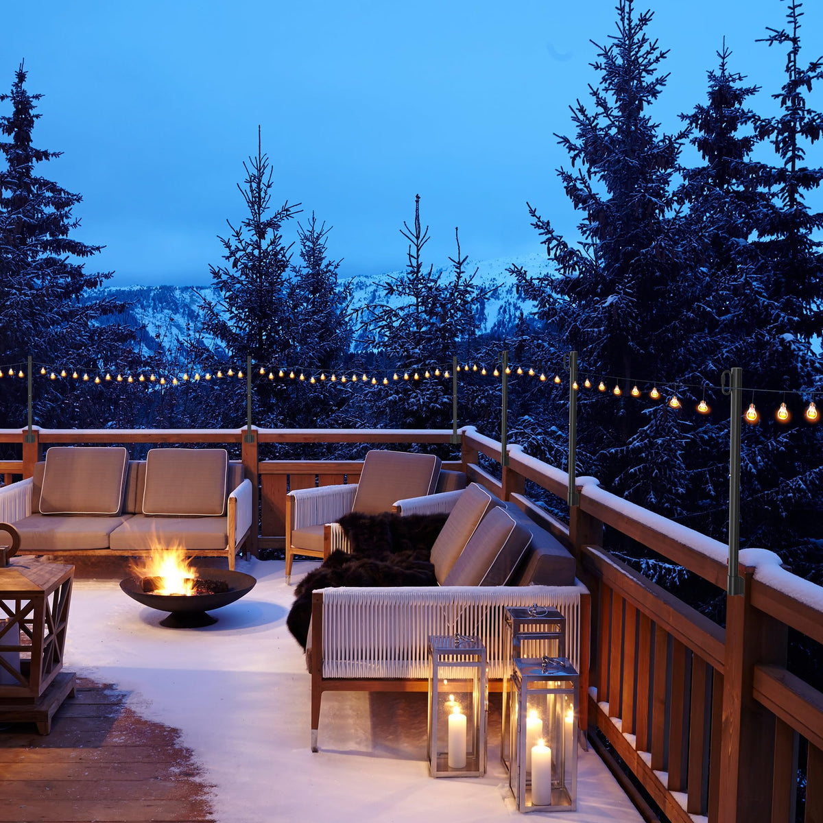 Suchtale suspension string lights on outdoor poles over a backyard gathering.