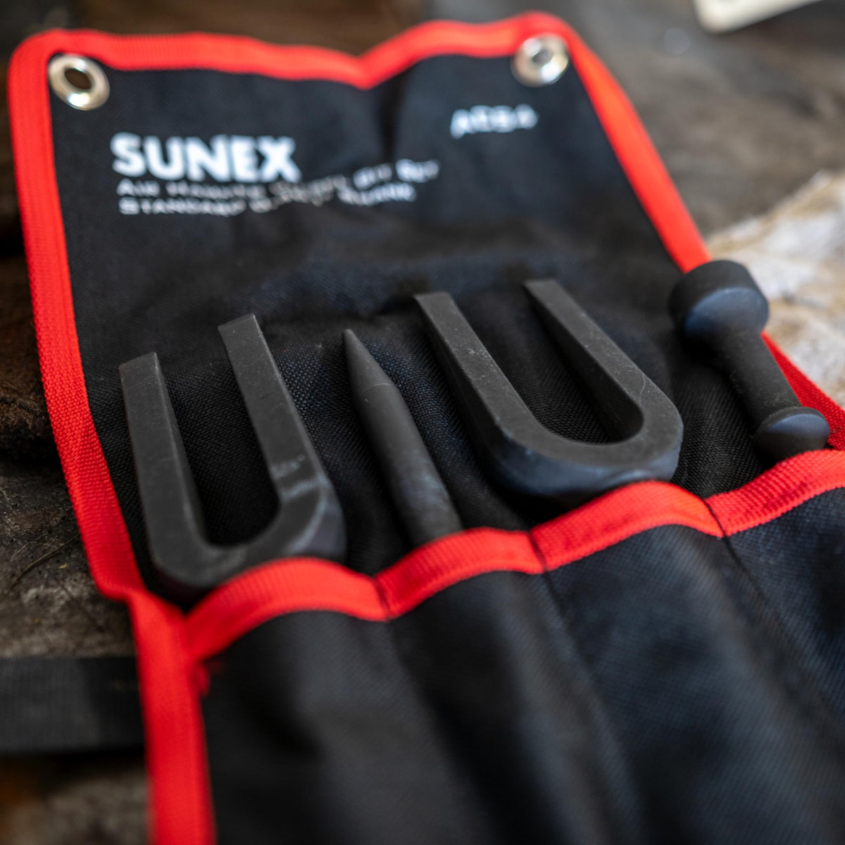 Sunex Tools ACS4 tie rod spreader for steady separation.