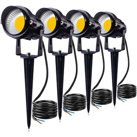 SUNVIE 12W LED landscape light brightens a patio wall with warm glow.