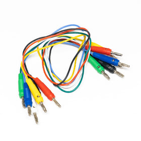 Alligator clips and adapters simplify secure connections during diagnostics.
