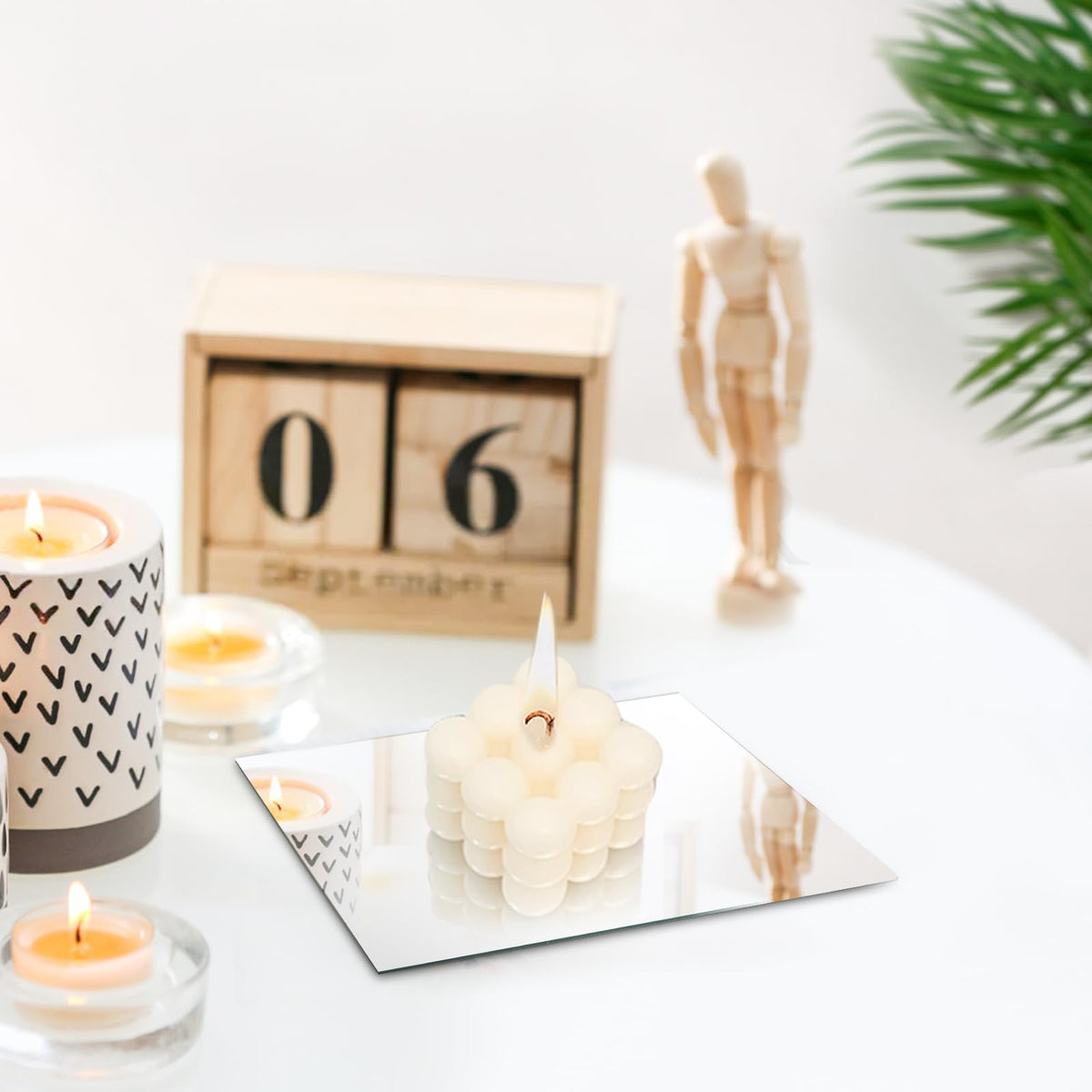 Suwimut DIY vase refresh with mirror tiles for a new look.