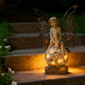 Suyorpe fairy figurine on flower ball closeup for decor