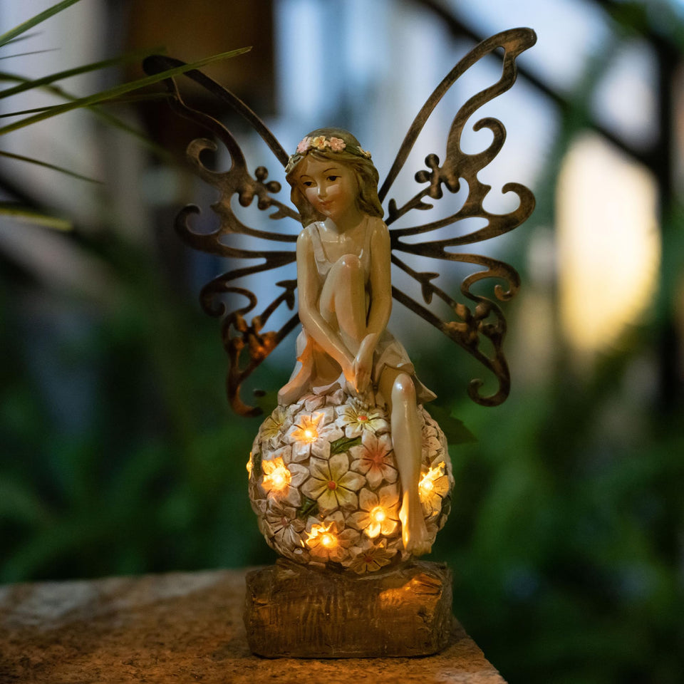 Suyorpe solar garden fairy statue on a flower ball lights outdoor spaces