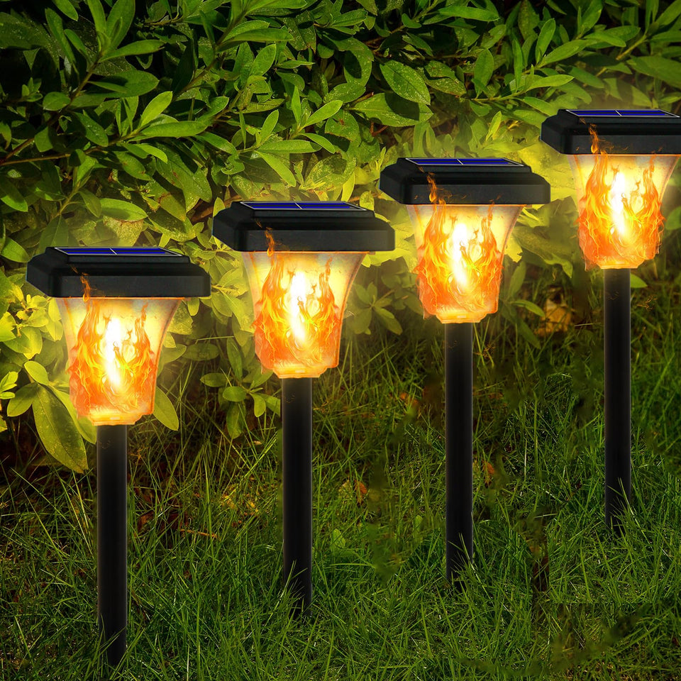 Swingers solar torch lights 4-pack flame glow for walkways and patios.