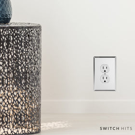 Switch Hits glass mirror plate enhances a kitchen setup with a bright reflective surface.