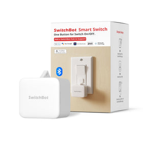 SwitchBot Fingerbot on a wall rocker switch for hands-free lighting control.