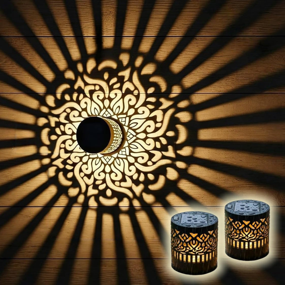 SXXSMYWR decorative solar mandala light casts pattern glow on fence.