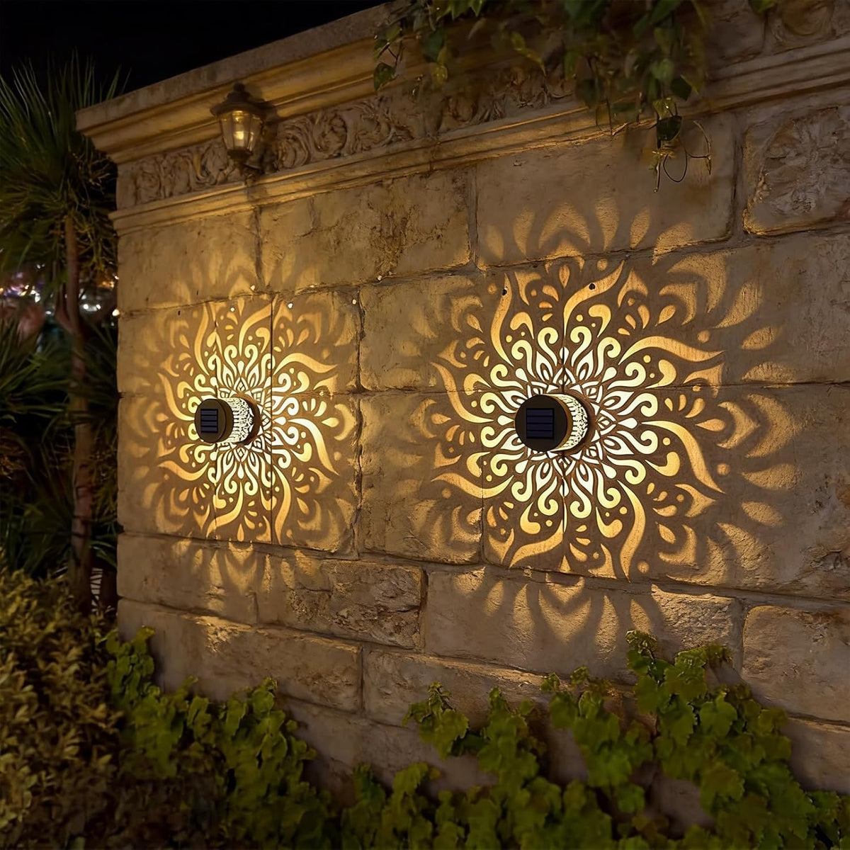 SXXSMYWR outdoor solar mandala light illuminating garden walls with a warm glow.
