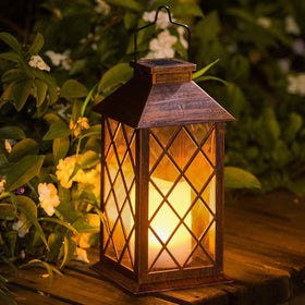 Take Me 14inch solar lantern for outdoor garden with warm glow at dusk.