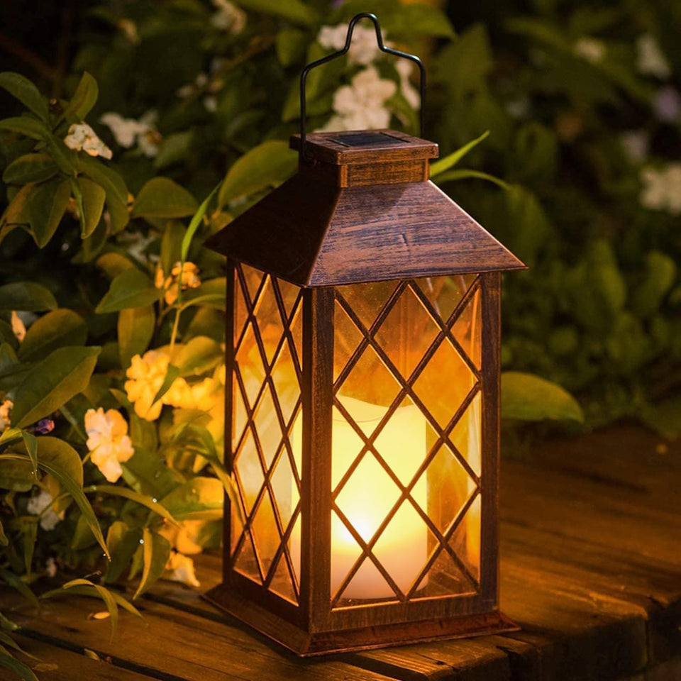 Take Me 14inch solar lantern for outdoor garden with warm glow at dusk.