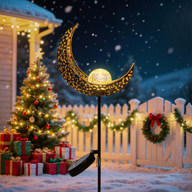 TAKE ME Moon Solar Light lawn decor beside flower beds.