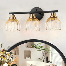 Taloya bathroom vanity light with amber shades casts warm glow over mirror.