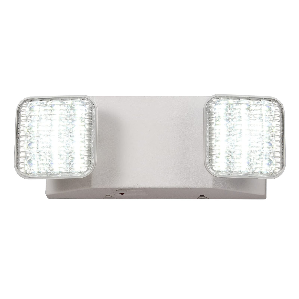 TANLUX emergency light with adjustable heads illuminating hallway and exit areas.