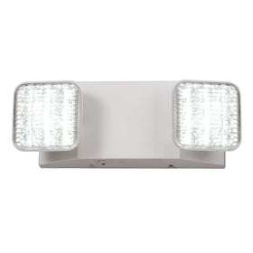 TANLUX emergency light with adjustable heads illuminating hallway and exit areas.