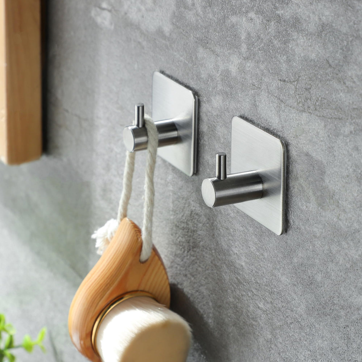 Taozun two sticky hooks complement the towel bar for versatile storage.