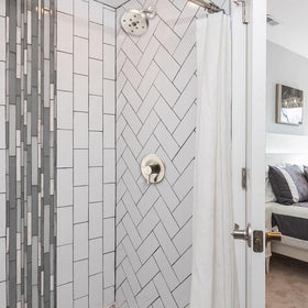 Tearel brushed nickel trim adds modern, clean lines to bathroom decor.