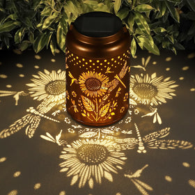 Tepaken Dragonfly and Sunflower solar lantern glow warmly for cozy garden evenings.