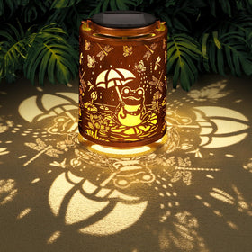Tepaken Frog Lanterns hanging create a warm garden glow for evenings outdoors.