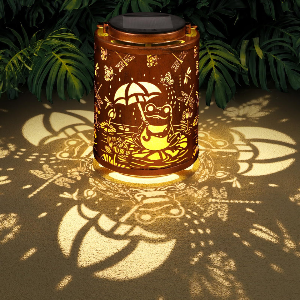 Tepaken Frog Lanterns hanging create a warm garden glow for evenings outdoors.