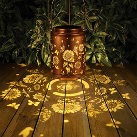 Tepaken garden lantern hangs from trees to illuminate outdoor gatherings.