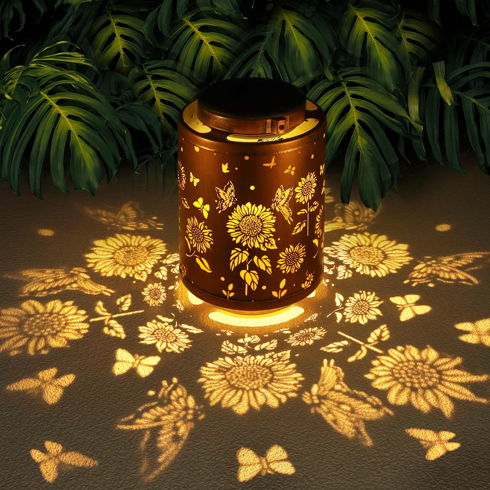 Tepaken solar lantern with butterfly pattern glows softly for garden ambiance.