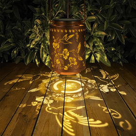 Tepaken solar lantern hanging on a tree for easy outdoor lighting.