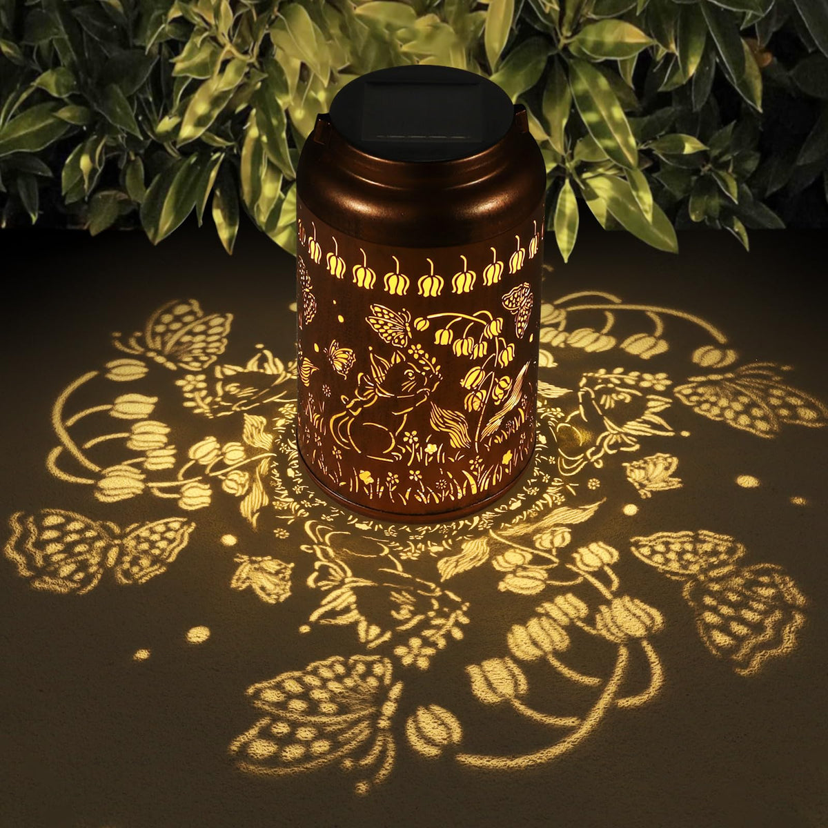 Tepaken solar lantern with hummingbird motif in copper finish for outdoor ambiance