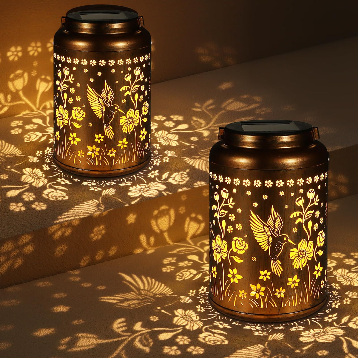 Tepaken solar lantern with hummingbird pattern lights an outdoor garden.