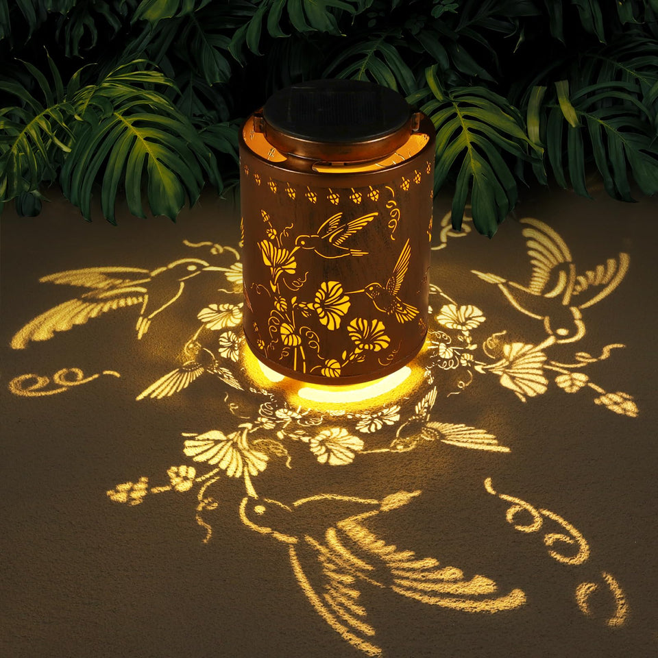 Tepaken solar lantern hummingbirds design provides warm ambient light outdoors.