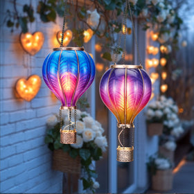 Teresa's Collections 18-inch purple balloon lantern emits a soft glow for gardens