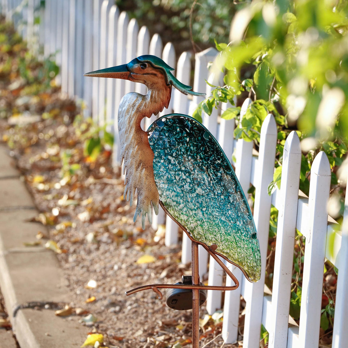 Teresa's Collections rust-resistant blue heron finish withstands rain and snow throughout seasons.