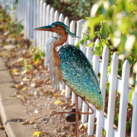 Teresa's Collections rust-resistant blue heron finish withstands rain and snow throughout seasons.