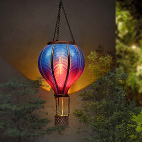 Blue purple balloon lantern serves as garden focal point