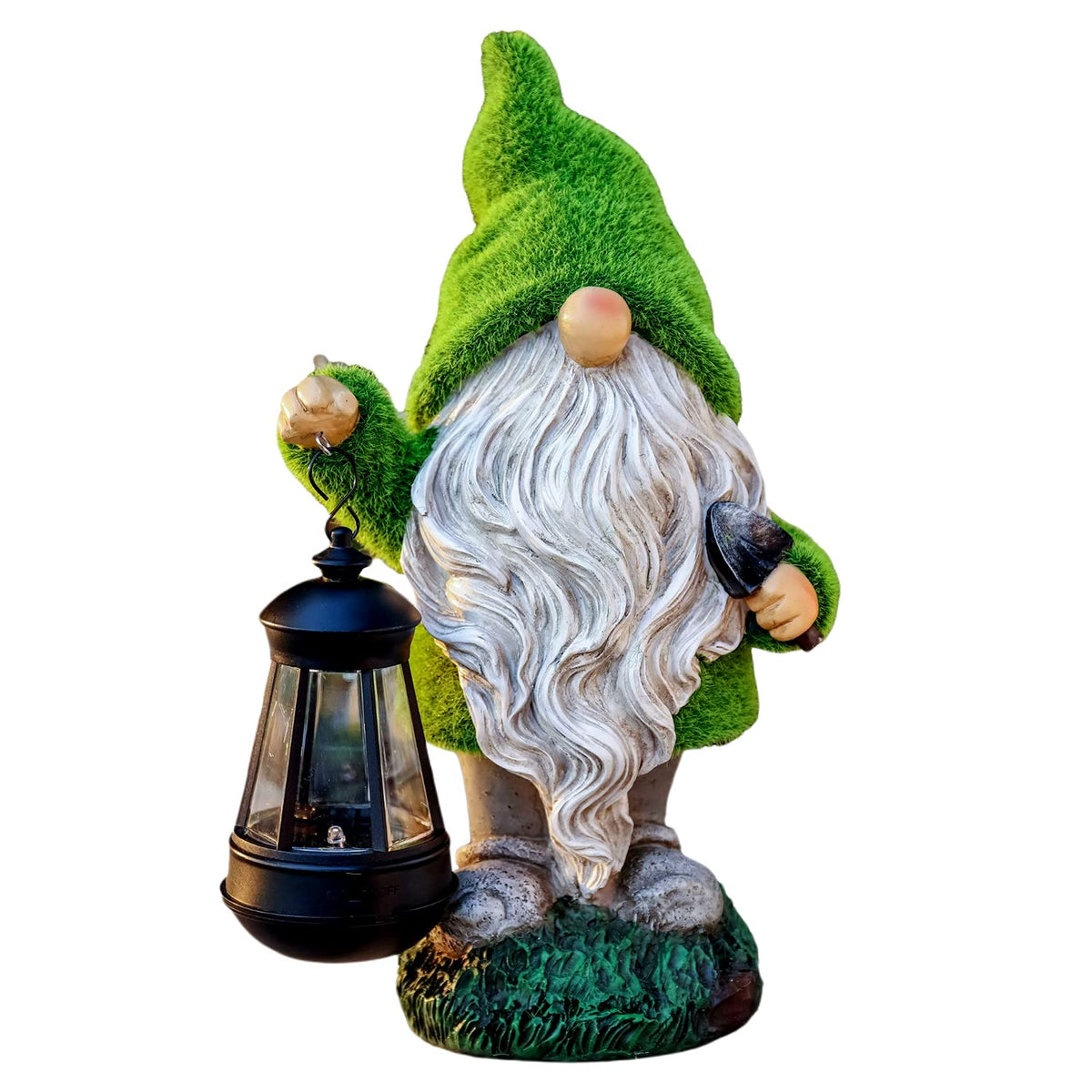 TERESA'S COLLECTIONS gnome with lantern lights the garden at night, enhancing curb appeal.