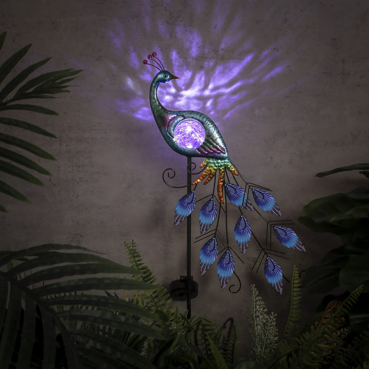 Teresa's Collections decorative peacock enhances patios and garden borders