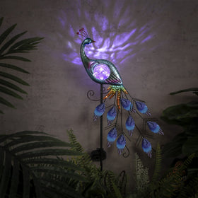 Teresa's Collections decorative peacock enhances patios and garden borders