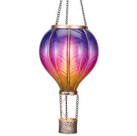 TERESA'S COLLECTIONS hot air balloon solar lantern glows in the garden at dusk