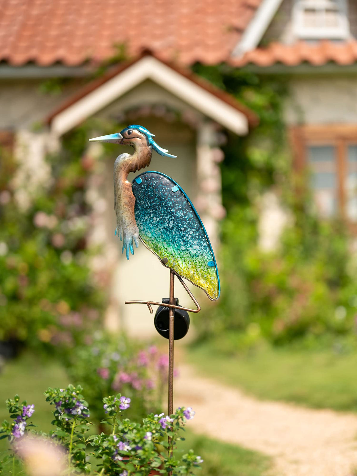 Teresa's Collections outdoor garden stake adds elegant azure focal point.