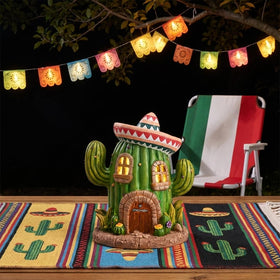 Teresa's Collections solar-powered garden figurine invites evening admiration in twilight.