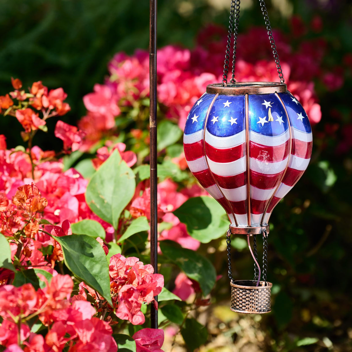 TERESA'S COLLECTIONS waterproof plastic lantern stands up to weather while keeping its charm.