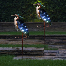 Teresa's Collections yard art brightens patios and walkways with azure glow.