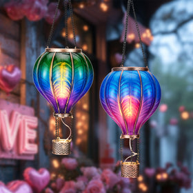 TERESA'S COLLECTIONS 2-pack hanging solar lanterns illuminate outdoor patios at night