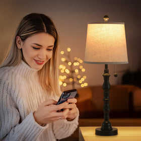 Terpsichore bedside lamps create warm reading light on nightstand