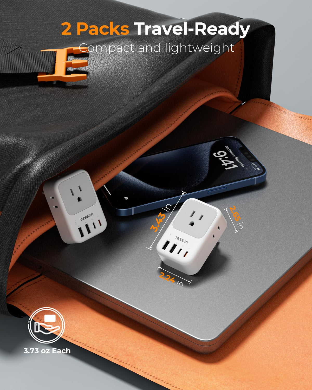 TESSAN travel adapter in-use at hotel desk with devices.