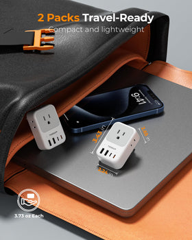 TESSAN travel adapter in-use at hotel desk with devices.