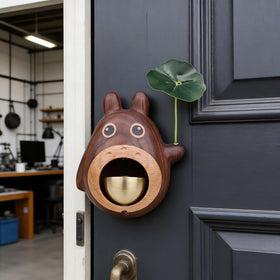 Close-up of Thavgaf shopkeepers bell in walnut finish.