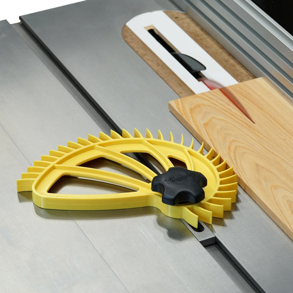 The Hedgehog featherboard on a table saw demonstrates quick pivot adjustment.